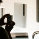 A man takes photos of the PS3 consoles and a prototype boomerang controller.